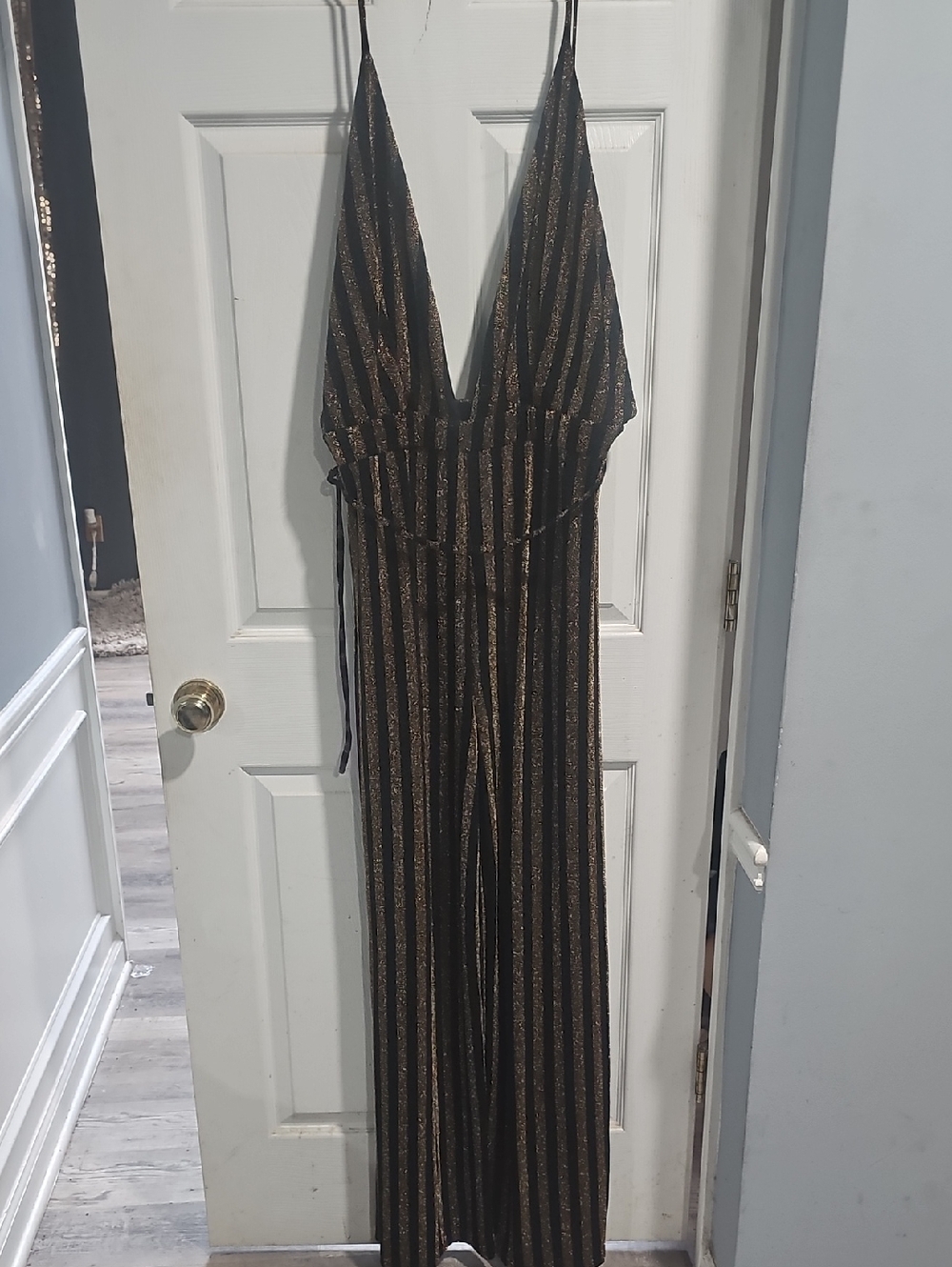 Fashion Nova Black and Gold Striped Plunging Jumpsuit